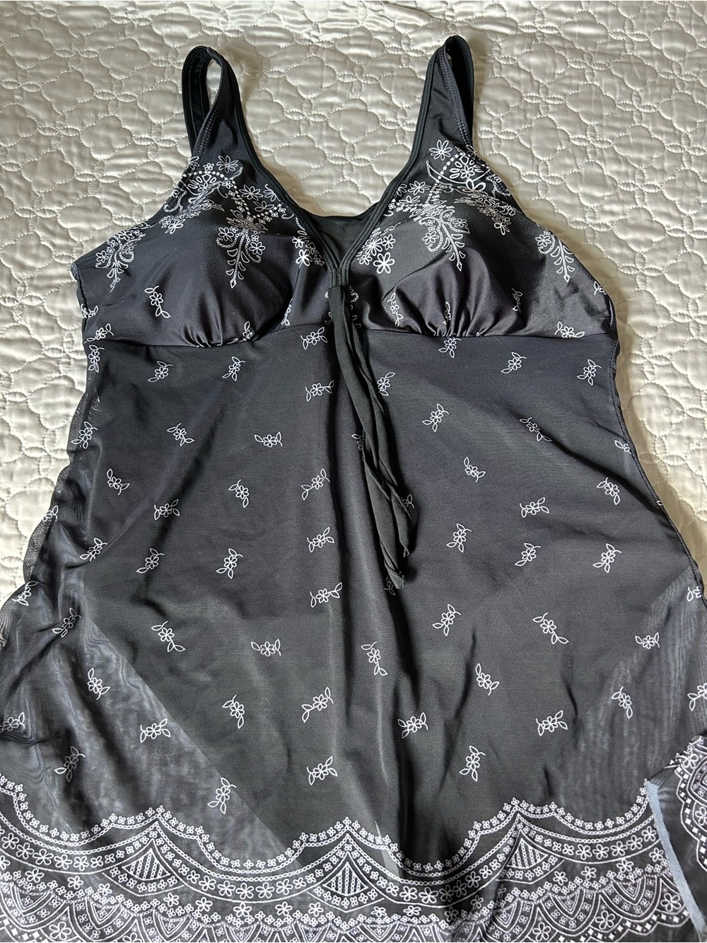 Woman’s black one-piece mesh tankini swim dress